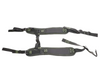 Black safety harness with green buckles on a white background